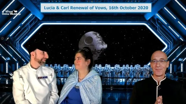 Costumed couple enjoying a Star Wars themed Online Renewal of Vows Ceremony, with Virtual Minister and images of Death Star and Storm Troopers on deck of a Starship in background.
