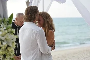 Virtual Celebrant and lovely couple, next to sea, crying bride.